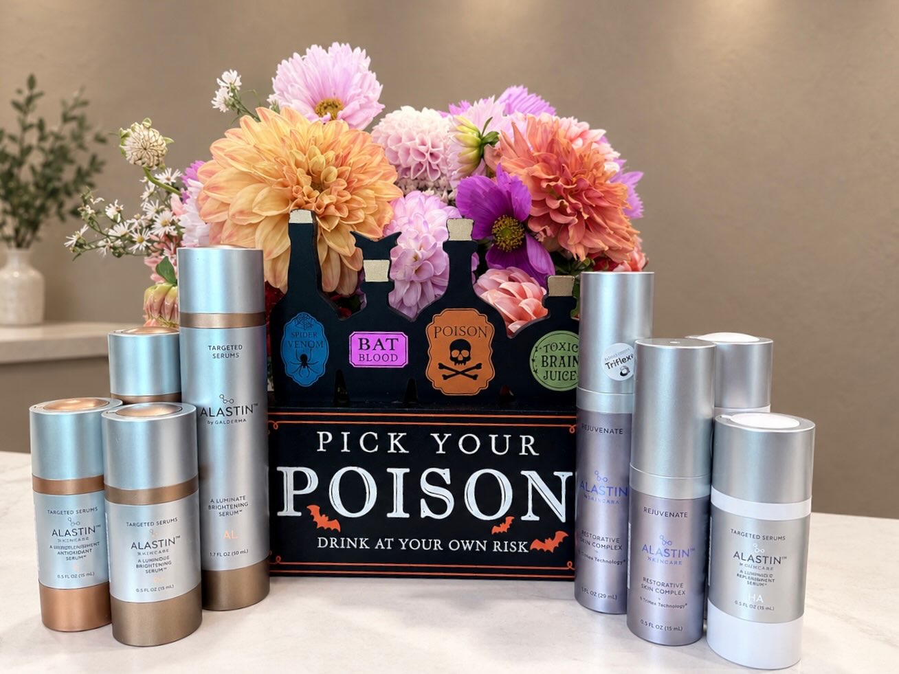 The Pick Your Poison display of Alastin Skincare products at Refined